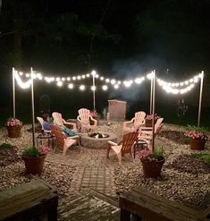 a fire pit surrounded by chairs and lights