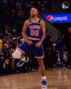 a basketball player running on the court with his foot in the air and people watching