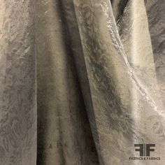 This stunning organza is a black color. Unique for the gorgeous and subtle floral jacquard pattern and day-to-night wearability, this organza is a popular choice for chic dresses, skirts, and blouses . This fabric is sheer, therefore a lining is needed if additional structure and modesty is desired. SKU: 6717 Content: 100% Silk Color: Black Width: 56 inches Origin: Italy Elegant Brocade Fabric For Formal Occasions, Elegant Jacquard Fabric For Evening, Elegant Jacquard Fabric For Wedding, Elegant Brocade Fabric For Party, Elegant Organza Fabric For Party, Skirts And Blouses, Floral Jacquard, Jacquard Pattern, Chic Dresses