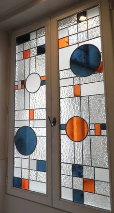 two stained glass windows with circles on them