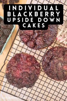 individual blackberry upside down cakes on a cooling rack