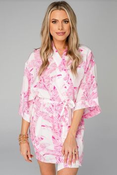 -Tropical Pink Palm Robe-  Our robe recently got an upgrade to a buttery silky fabric that we absolutely LOVE. This is a luxe satin-like material with kimono style short sleeves, tie closure and a perfect fit. This robe is a great gift to or treat yourself as part of your self care ritual.  One Size 33 in length. 100% Polyester. Machine wash cold and hang dry. Summer Silk Kimono With Tie Waist, V-neck Silk Summer Robe, Silk V-neck Robe For Summer, Summer Silk Loungewear Robe, Summer Silk Robe For Sleep, Summer Silk Lounge Robe, Tie Waist Kimono For Loungewear, Silk Robe For Spring Vacation, Silk Robe For Vacation In Spring