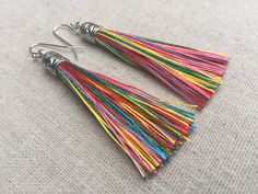 "Chic multi color tassel earrings! They would add a pop of color to any outfit for any occasion. Dress them up or down. They are timeless and versatile. They are lightweight, fun and unique! The tassels measure 2 1/8\" long by 1/4\" wide. They hang from simple silver ear wire hooks. Overall drop length is about 2 1/4\". Metal is allergy free plated silver. These are my latest creation! I have them available in many colors! Find them all under the category tassel earrings in my shop. Thanks for s Rainbow Tassel Earrings For Gifts, Rainbow Fringe Earrings As Gift, Rainbow Dangle Tassel Earrings Gift, Colorful Dangle Tassel Earrings Gift, Rainbow Tassel Dangle Earrings, Rainbow Dangle Tassel Earrings, Multicolor Tassel Earrings As A Gift, Colorful Tassel Earrings As A Gift, Colorful Tassel Earrings For Gift