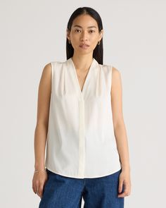 Our popular stretch silk blouse but now sleeveless. It's a classic, versatile look with a bit of stretch for a more forgiving fit and additional versatility. Perfect for work meetings, or stepping out to brunch. Plus, silk fiber contains 18 kinds of amino acids that make it amazing for skin nourishment, hypo-allergenic, and naturally thermoregulating to help maintain body temperature.  | Quince | Women's 100% Washable Silk Stretch Sleeveless Blouse in Ivory, Size Medium Sleeveless Silk Blouse, Work Meetings, Silk Fiber, Square Toe Shoes, Body Temperature, Comfortable Heels, Warm Autumn, Woven Top, Mulberry Silk