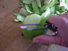 someone cutting up an apple with a pair of scissors