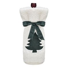 a white and green christmas stocking with a tree on the front, hanging from a wooden hanger