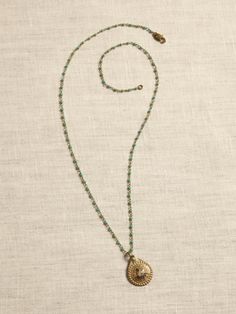 A tiny, dimensional medallion stamped with a simple flower design hangs from a delicate turquoise bead and brass link chain.  MODERN TURQUOISE COLLECTION: Turquoise, a treasured stone with history and lore embedded in many cultures from Egypt and Per Simple Flower Design, Turquoise Bead Necklaces, Simple Flower, Simple Flowers, Bead Jewelry, Green Stone, Turquoise Beads, Turquoise Jewelry, Tibet