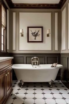 A classic bathroom with a freestanding clawfoot tub, elegant wall paneling, and refined lighting, offering a timeless and sophisticated ambiance. Small Timeless Bathroom, French Country Master Bath, Colonial Bathroom Ideas, Tile Bathroom Walls, Paneled Bathroom, English Bathroom Ideas, Victorian House Bathroom