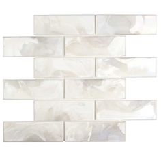 a white tile wall that has been made out of marble tiles and is lined with wavy lines