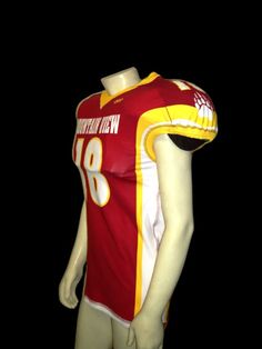 a mannequin wearing a red and yellow football uniform