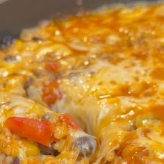 a casserole dish with cheese, meat and vegetables