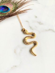 Alluring textured Turkish snake pendant necklace on a 14k gold chain Pendant: 2" Long Necklace: 12" Long in total Gold Snake Necklace, Gold Chain Pendant, Snake Pendant, Gold Chain With Pendant, Snake Necklace, Gold Snake, Chain Pendant, Chain Pendants, Long Necklace