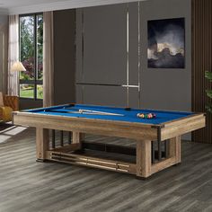 a pool table in the middle of a living room