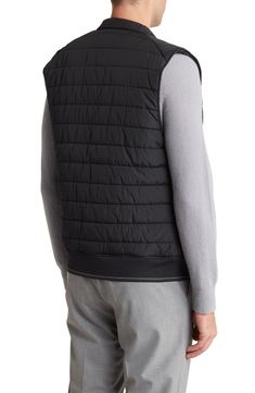 A spread collar punctuates this streamlined, channel-quilted vest with an extra element of timeless sophistication. 26" length Front zip closure Stand collar Lined, with polyester fill 100% polyester with polyurethane coating Machine wash, dry flat Imported Classic Sleeveless Solid Outerwear, Down Vest With Padded Collar, Sleeveless Black Down Outerwear, Sleeveless Down Vest With Padded Collar, Black Quilted Nylon Vest, Quilted Black Nylon Vest, Black Sleeveless Vest With Padded Collar, Functional Black Vest With Padded Collar, Black Nylon Vest With Zipper Closure