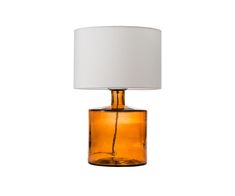 an orange glass table lamp with a white shade on it's top and bottom