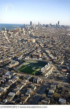 an aerial view of a baseball stadium in the city