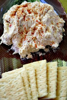 a plate with crackers and some food on it