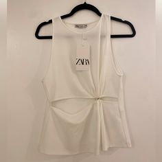 Sleeveless Tank Top From Zara. New With Tags. Size S. Chic Sleeveless Vest Top, White Sleeveless Party Top, Chic Spring Tank Vest, Chic Sleeveless Summer Vest, Sleeveless Denim Vest For Day Out, Chic Sleeveless Summer Tank Top, Summer Sleeveless Tank Top For Night Out, Chic Cami Vest For Spring, White Sleeveless Tank Top For Party