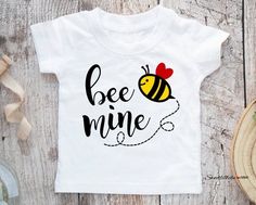 Adorable Bee Mine Toddler T-shirt for Valentine's Day.  Click through for other adorable toddler tees/baby Onesies.  #beeminetoddlertee, #ValentineDaytoddlerTshirt, #Valentineshirt, #beetoddlertee Toddler Valentines, Bee Mine, Gender Neutral Baby Clothes, Toddler Tees, Valentines Shirt, Sweet Girls, Toddler Girl, Valentine Gifts, Onesies