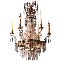 an antique chandelier with crystal drops hanging from it