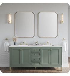 there are two mirrors on the wall above the double sinks in this bathroom, one is green and the other is white