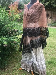 Antique chocolate brown lace shawl veil with lovely black lace border with bold floral design gently scalloped edge late 1800s. The shawl is quite large and square in shape, the chocolate brown centre lace has an all over diamond pattern & a bold floral border is a true dense black.  Good quality lace, feels like silk, all edges are finished.  There are some loose ends and a few openings in the black lace border, quite small and hard to spot, see the last 3 pics, priced accordingly. An unusual l Loose Ends, Lace Border, Lace Shawl, Brown Diamond, Floral Border, Diamond Design, Vintage Lace, Diamond Pattern, Black Floral