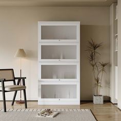 a living room filled with furniture and a white book shelf