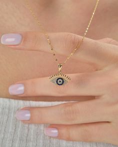 Material: Gold Carat: 14K (585) Solid Gold 14K Solid Gold Mini Evil Eye Pendant, Minimal Evil Eye,  Protective Charm Pendant, Dainty Gold Blue Necklace, Mati Charm Nekclace, Gift for Her Ring Details 14K Solid Gold Plated is not gold it is real solid gold Gold Color Options; Yellow Gold, White gold, Rose Gold, - All products are made to order in Turkey. - This product is sleek and stylish. It is produced carefully to make you and your loved ones happy. Prepared with love and experience. - All je Blue Pendant Jewelry With Delicate Chain, Gold Evil Eye Pendant Jewelry, Sapphire Necklace With Adjustable Chain, Blue Clavicle Chain Charm Necklace, Blue Charm Necklaces With Adjustable Chain, Evil Eye Gold Pendant, Elegant Blue Necklace With Evil Eye, Elegant Blue Necklace With Evil Eye Detail, Gold Evil Eye Pendant Charm Necklace