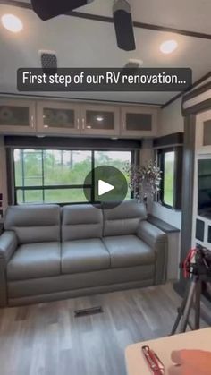 a living room with a couch and television inside of it, in front of a window that reads first step of our rv renovation