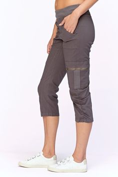 A stretch poplin crop with comfort & style. Features a pull on elastic waistband, two front pockets and two cargo zip pockets, clean back and style lines for added comfort. Stretch poplin body - 96/4 Cotton/Spandex 2x1 rib on waistband - 95/5 Cotton/Spandex Color description: Our favorite dark grey Waistband: 2" Elastic Inseam: 22" XS-XL Front rise: ~12" Back rise: ~20.5" 1X-3X Front rise: ~10" Back rise: ~15" Machine washable Preshrunk Imported MODELS Megan is wearing size X-Small Height: 5'10" | Bust: 34B | Waist: 25" | Hip: 34" Casual Capri Length Cargo Pants, Casual Cargo Capri Pants With Pockets, Sporty Fitted Cargo Pants With Pockets, Sporty Cargo Pants With Side Pockets For Work, Fitted Sporty Cargo Pants With Pockets, Fitted Utility Cargo Parachute Pants, Cotton Capris With Pockets For Fall, Fall Cotton Capris With Pockets, Fitted Parachute Pants With Multiple Pockets For Spring