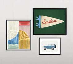 three framed art pieces hang on the wall next to each other, including a blue car