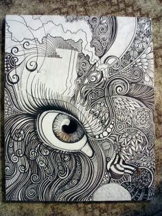 a drawing of an eye with swirls and waves in the background on a piece of paper