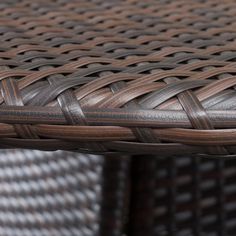 a close up view of a table made out of wicker and leather materials