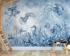 an ocean scene with jellyfish and other marine creatures painted on the wall