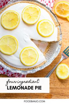 a lemonade pie on a wooden table with sliced lemons