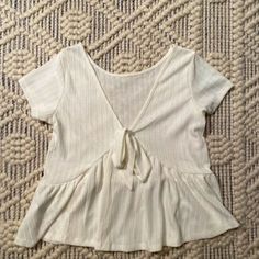 Light And Super Cute/Flowy Top. Never Worn- A Bit Too Big Bundle All Tanks/Tops- 2 For 12 3 For 20 4 For 30 Off White V-neck Top For Day Out, Fitted Off White Short Sleeve Tops, Off White Cotton V-neck Top, Off White Short Sleeve Tops For Spring, Tie T Shirt, Tanks Tops, Tied T Shirt, Flowy Top, Flowy Tops