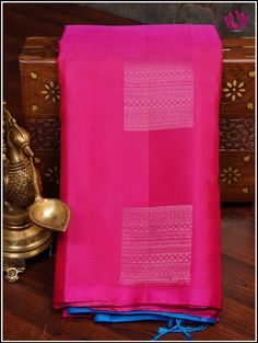 This Kanjivaram/ Kanchipuram soft silk saree is an elegantly crafted handloom saree with a Pink and Blue combination and borderless fashion. Intricate motifs in silver zari adorn the pallu and alternate gold and silver zari motifs grace the body. Perfect for any occasion, this saree is sure to make a lasting impression. Its handmade tassels give it a traditional and timeless look. It comes with an unstitched plain blouse piece. Fall and Pico - done Handmade tassels Blouse - unstitched Handloom s Silk Mark Certified Paithani Silk Saree For Wedding, Wedding Paithani Silk Saree Silk Mark Certified, Tussar Silk Saree Blouse Piece For Rituals, Tussar Silk Saree With Self Design For Rituals, Silk Mark Certified Tissue Silk Saree In Traditional Drape, Silk Mark Certified Tissue Silk Saree, Festive Tissue Silk Saree With Silk Mark Certification, Festive Tissue Silk Saree, Silk Mark Certified, Festive Tissue Silk Saree Silk Mark Certified