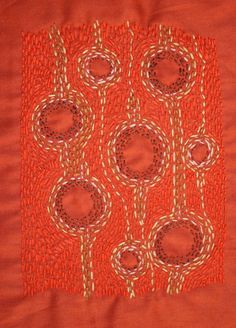 an orange piece of cloth with circles on it