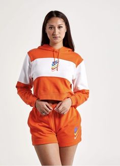 This Sport DNA Fleece Hoodie from Nike Sportswear takes inspiration from the brand's vintage styles. It features a colorful front logo print and is done in a boxy, oversized fit. Swoosh graphic printed at front French terry fabric for comfort Ribbed sleeve cuffs and hem Attached hood with adjustable drawstring Cropped length Color Shown: White/Orange Style: #DM6758-817 MSRP: $65 Nike Cropped Hoodie, Orange Pullover, Women's Sportswear, Womens Air Jordans, Hoodie Xxl, Nike Sweatshirts, French Terry Fabric, Nike Sports, Nike Hoodie