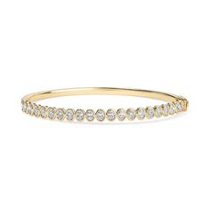 The Bezel Oval Bangle is timeless and traditional. This bangle can dressed up for formal occasions or worn casually for a touch of everyday elegance. It is also a beautiful alternative to a tennis bracelet. Available in 14K Yellow Gold and White Gold Diamond weight = 1.95 carats Diamond quality = GH-Color, SI-Clarity Available in a Size Small = 17cm wrist Formal Oval Bangle With Diamond Accents, Classic Oval Bangle With Diamond Accents, Timeless Stackable Diamond Bracelet, Elegant Bangle Bracelet With Bezel Setting, Elegant Bezel Set Bangle Bracelet, Classic Hand Set Yellow Gold Bangle, Classic Hand Set Oval Bracelets, Classic Oval Diamond Bracelet With Accents, Classic Yellow Gold Bangle With Brilliant Cut