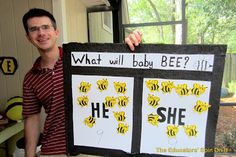 a man holding up a sign with bees on it