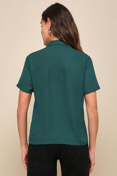 It's easy to dress for success when you have the Lulus Good Luck Charm Dark Green Short Sleeve Button-Up Top in your closet! This classic collared top has a full covered button and loop placket running the length of its breezy, woven fabric bodice. This sweet little top keeps the charm going with its boxy silhouette and front patch pocket, perfect for transitioning between casual cool and office chic! Fit: This garment fits true to size. Length: Size medium measures 23.75" from shoulder to hem. Collared Tops With Hidden Button Closure For Work, Versatile Collared Shirt With Button Closure, Green Office Tops With Button Closure, Collared Tops With Hidden Button Closure For Office, Green Short Sleeve Tops For Business Casual, Collared Tops With Snap Buttons For Business Casual, Versatile Solid Shirt With Button Closure, Collared Tops With Button Closure For Business Casual, Green Collared Top With Snap Buttons