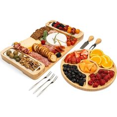 two wooden trays filled with different types of food and utensils next to each other