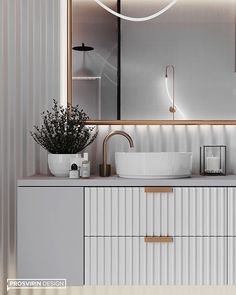 a bathroom with a sink, mirror and lights on the wall above it's counter