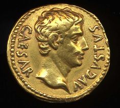 an old gold coin with a man's head on it, and the words strassa in roman writing