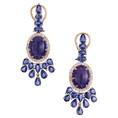 Spectacular Tanzanite, Sapphire and diamond dangle earrings. 2 vibrant oval cabochon tanzanite gemstones totaling 12.00cts are known for their exquisite blue-violet hue, are the centerpiece of these earrings. They are mounted in 18k yellow gold clip post settings, each with a halo of 25 round cut diamonds. The earrings are also adorned with pear and oval cut sapphires which are a deep rich blue color, creating a harmonious contrast. 2 oval cabochon purplish blue Tanzanite, approx. total weight 12.00cts, moderate inclusions, 12.50 x 9.94 x 7.13mm 50 round full cut Diamonds, approx. total weight 1.00cts, H, SI 6 oval blue Sapphires, approx. total weight 1.80cts, 4.4 – 5.2 x 3.2 – 3.5mm 22 pear blue Sapphires, approx. total weight 6.60cts, 3.6 – 5.2 x 3.1 – 3.8mm 18k rose gold Top to bottom: Fine Jewelry Sapphire Tanzanite Earrings, Fine Jewelry Tanzanite Earrings In Sapphire Color, Elegant Gold Tanzanite Earrings, Luxury Tanzanite Gemstone Earrings, Luxury Blue Tanzanite Earrings, Rose Gold Top, Bleu Violet, Blue Tanzanite, Diamond Dangle Earrings