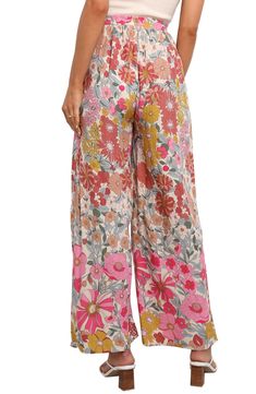 An exquisite floral print swirls around these flowy lounge pants styled with an elastic waist so you can enjoy moving or lounging with ease every day. Elastic waist Front slant pockets Unlined 100% rayon Hand wash, dry flat Imported Floral Print Wide Leg Pants For Day Out, Floral Print Wide Leg Pants For Vacation In Spring, Floral Print Wide Leg Pants For Spring Vacation, Floral Wide Leg Pants For Vacation In Spring, Vacation Floral Print Wide-leg Pants, Floral Print Wide-leg Pants For Vacation, Casual Wide Leg Pants With Floral Print, Relaxed Fit, Floral Print Wide Leg Vacation Bottoms, Vacation Floral Print Wide Leg Bottoms