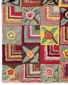 a multicolored patchwork rug with flowers and leaves