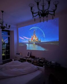 a bedroom with a large projection on the wall