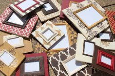 a pile of different colored frames sitting on the ground